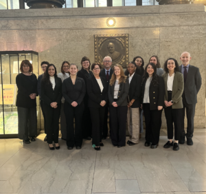 A photo of 15 staff members of Women's Law Project inside the Pittsburgh courthouse.